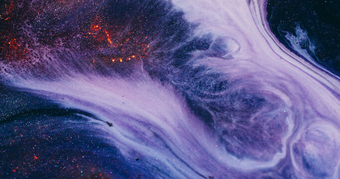Art emulsion. Ink wave. Sparkling marble white purple liquid abstract texture. Color orange particles flow defocused blue background.