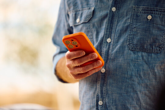 Anonymous man uses smartphone