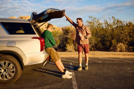 Men talk on the roadside near Skull Rock