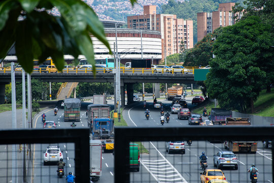 Traffic Flows Along a Busy Highway in a Vibrant Urban Area in Medellin