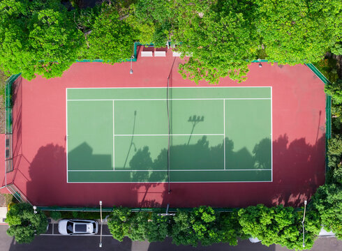 Aerial View of Tennis Court Surrounded by Green Trees