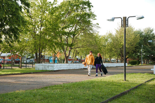 Couple Strolling Through a Green Urban Park