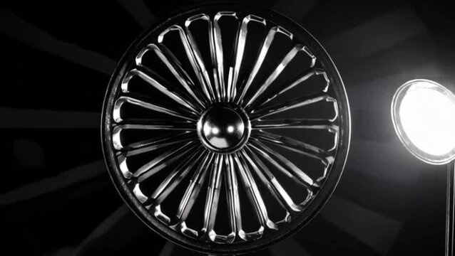  Ashoka Chakra rotating slowly in spotlight, metallic reflections, deep shadows
