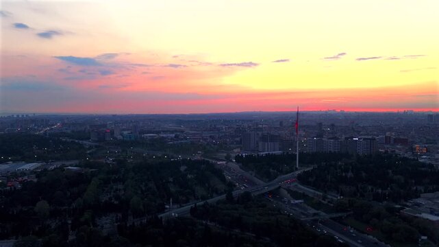Fatih Istanbul Turkey T&uuml;rkiye national flag the Golden Horn Blue Mosque temple Mosque aerial drone sunset golden hour dusk cityscape buildings cars traffic highway forward motion