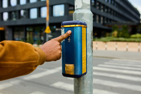 Anonymous man crosses the street