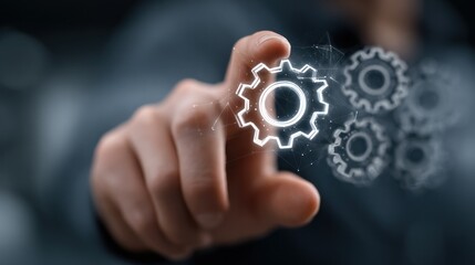 A hand touching a digital cogwheel representing technology and innovation on a screen