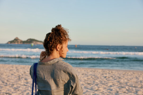 Woman Looking Out at the Ocean