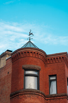 Red brick turret with weather vane