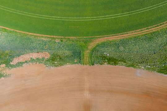 Gateway joining two circular farm fields