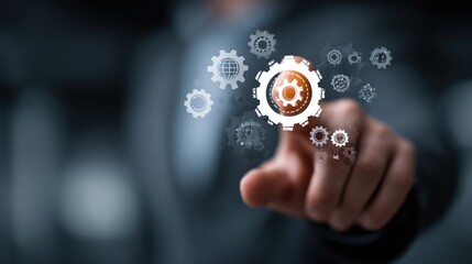 Human hand pointing at gears, symbolizing technology and innovation in a digital world