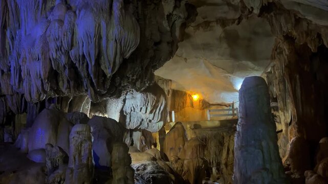 Wang Vieng, Laos.Tham Jang Cave-stalactites and stalagmites in a karst mountain with a Buddha temple inside. There is a spring inside the cave. The cave is equipped with comfortable paths and lanterns