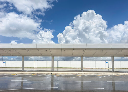 Empty Airport travel Parking Lot with clouds 