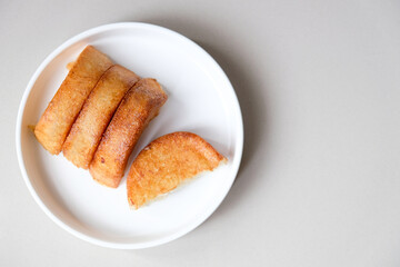 Kue pancong, gandos or bandros is an Indonesian traditional snack made from a mixture of rice flour, grated coconut, and coconut milk