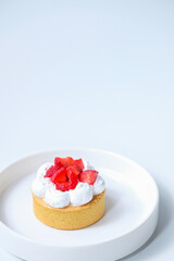 Strawberry cheese tart on a white plate