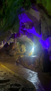 Wang Vieng, Laos.Tham Jang Cave-stalactites and stalagmites in a karst mountain with a Buddha temple inside. There is a spring inside the cave. The cave is equipped with comfortable paths and lanterns