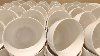 Rows of Stacked White Ceramic Cups