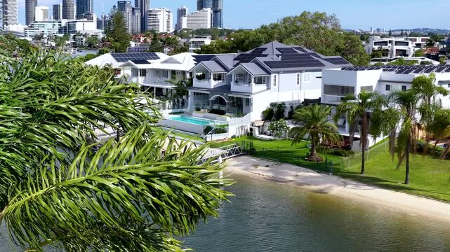 Aerial Pan Over Gold Coast Waterfront Luxury Homes and Skyline