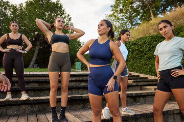 Group of women preparing for outdoor fitness training session