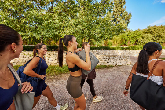 Group of women walking in a park after an exercise session