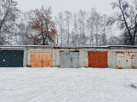 Row of old garages in winter