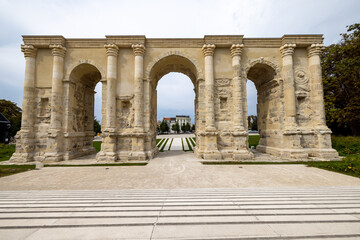 Reims, Marne, Grand-Est, France, August, 28th, 2025, Champagne Area, BArchway leads outward, Scenic classical archway stretching over manicured lawns and treelined promenade with diffused © Bjorn B