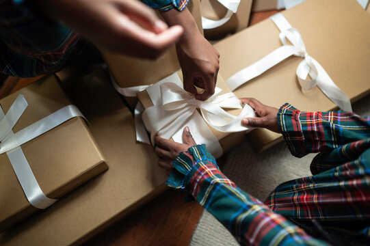 Wrapping Holiday Gifts With Care and Excitement in a Cozy Setting