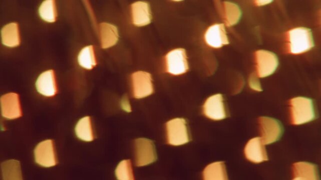 Defocused glow. Shiny texture. Hot orange color round optical vibrant dazzle lens flare on abstract light visual bokeh art background.