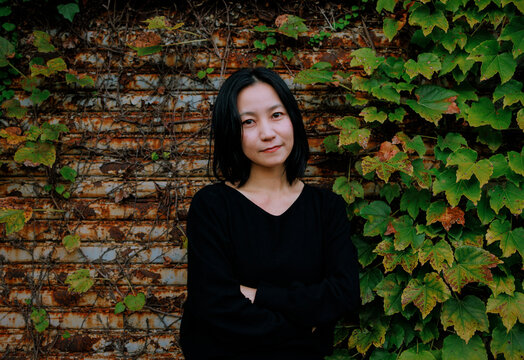 Portrait of a Woman at the Doorway of an Abandoned Warehouse.