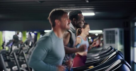 People, personal trainer and treadmill in gym for workout, athlete training and endurance for health. Cardio, running and machine with female runner, exercise and smile for wellness at fitness center - Powered by Adobe