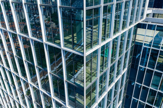 Close up view of modern glass building facade with reflections