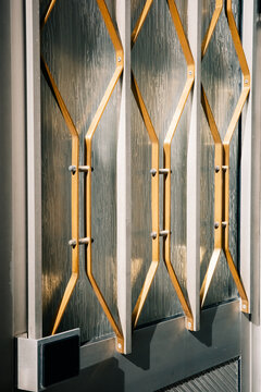 Unique Metal Door Design With Golden Geometric Patterns