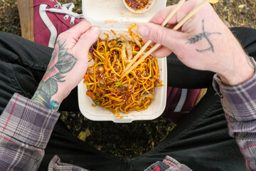 eating takeout noodles 
