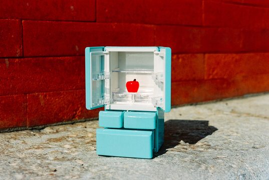 toy fridge with one apple, 35mm film