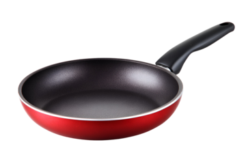 Red frying pan with black handle isolated on a black background studio shot
