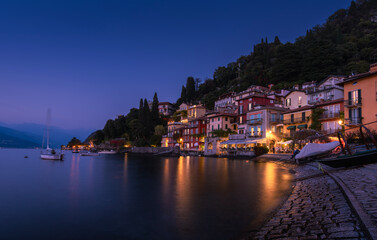 Lake Como Varenna blue hour romantic Italian lakeside village waterfront lights reflecting on calm water dreamy evening long exposure travel photography nightscape escape serene italy vacation dream