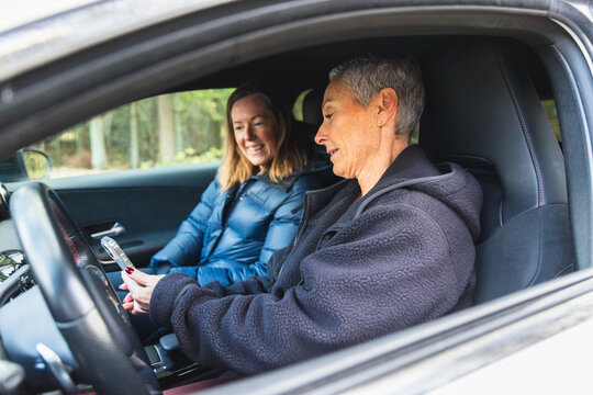 Two Women on a Road Trip, Sitting in a Car