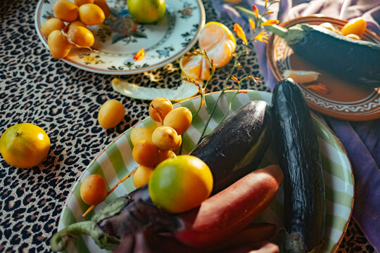 Fresh fruits and vegetables on a patterned table