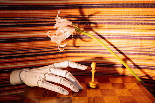 Hand and flower by chess piece