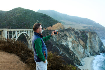 Man visits Bixby Creek Bridge in California