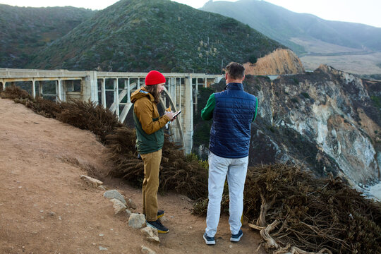 Men stands near Bixby Creek Bridge in California