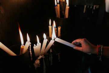 Candle lighting in ancient church