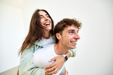 Joyful couple sharing a playful moment indoors
