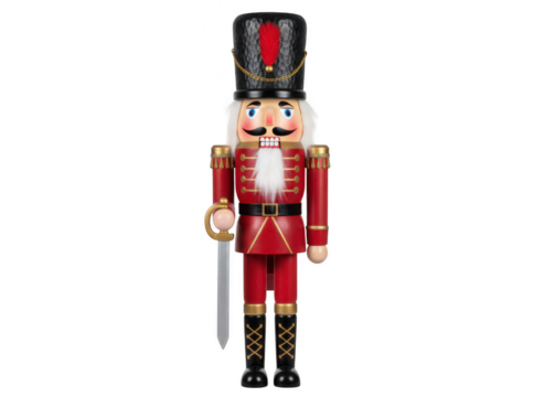 Traditional wooden nutcracker soldier figure dressed in a red military uniform and tall black hat, isolated on transparent background