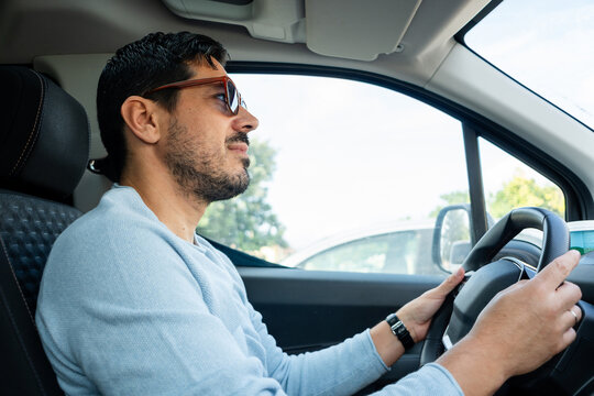 Man driving car in daylight
