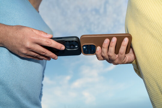 Two smartphones close together outdoors