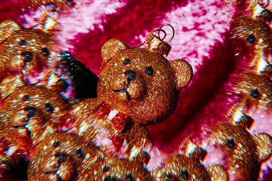 a golden teddy bear ornament in a kaleidoscopic image