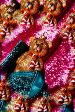 a sparkly teddy bear in a teal purse, kaleidoscopic