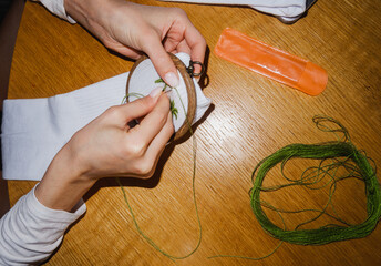 Creating Beautiful Embroidery on White Fabric With Green Thread