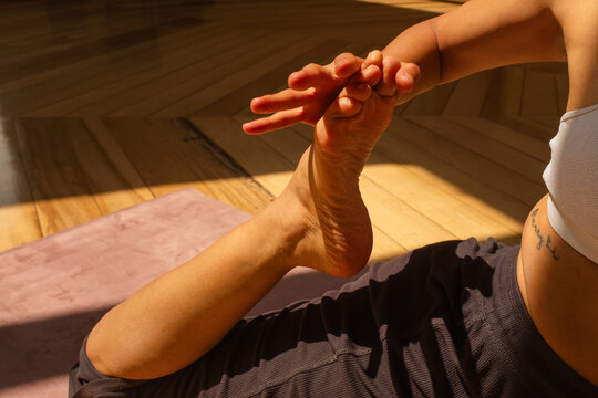 Close-Up of Woman Stretching During Yoga Practice