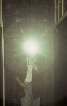 Film UGC mirror selfie of woman in fitting room with flash